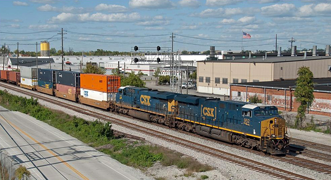 Chapter member Bill Grady:  “Here is a shot from yesterday (Sept 17) of our fairly new intermodal train, Q133 going by the MD signal at the North End of Osborn Yard (Louisville).  This is shot from a brand-new overpass just built to allow from more airport expansion.”