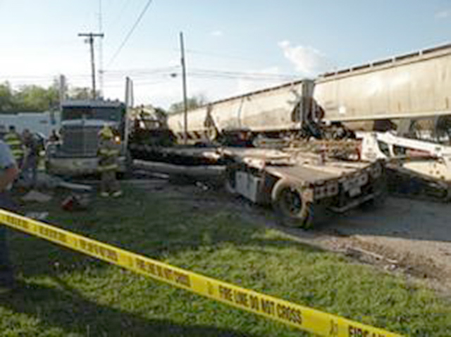 PEMBROKE (KY) — The driver of a tractor-trailer hauling farm equipment thought he had enough time to get across the train tracks to avoid being hit by the (CSX) train Thursday evening, but the trailer was struck In the rear, spinning the cab of the truck around and causing damage at the railroad crossing on Main Street in Pembroke.  Excerpt by David Snow, Eagle Post.