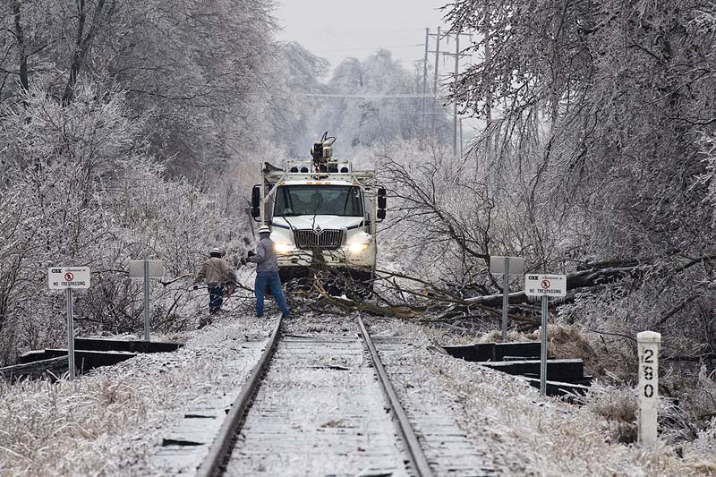 A CSX MOW crew works on clearing the tracks on the Morganfield Branch, west of Madisonville, Ky on January 28, 2008 after the ice storms that passed throught Kentucky in January, disrupting rail service through out the area for several days. (Photo by Jim Pearson)