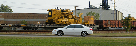 Great car! Oh, focus on the Cat!  “Too bad the Honda was in the way, but I was also driving at the same time. Caught this guy heading into Howell Yard here in Evansville back on 10/6/08. If you look close you can see another plow in the car ahead of this one.”  - Matt Gentry