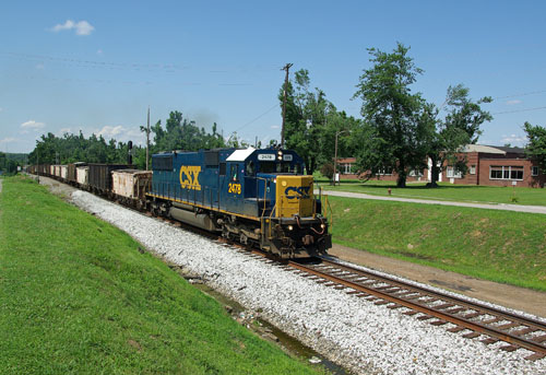 M036, an SD40-2 with a 2478 number and a string off ratty looking gons is southbound at Mortons Gap.  July 20, 2009.  Photo by Chuck Hinrichs