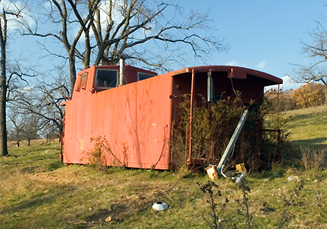 Former CB&Q Caboose (BN 10334) as it sits on Rex Easterly’s father’s farm in Missouri.  Rex is hopeful that the relic can be restored.  Rex just acquired the cab.
