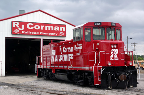 I (Chuck Hinrichs) was at Guthrie yesterday afternoon and caught R J Corman/Railpower Genset (Railpower #2406 RP20BD ) in fresh red paint outside the shop building.  R J Corman acquired the assets of Railpower earlier this year and 2406 has been on lease to UP but is now in the RJC fold.