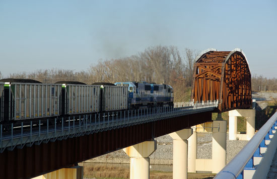 A coal train with Oakway power is crossing the new rail bridge over the Tennessee River.  Photo by Chuck Hinrichs  12/5/09