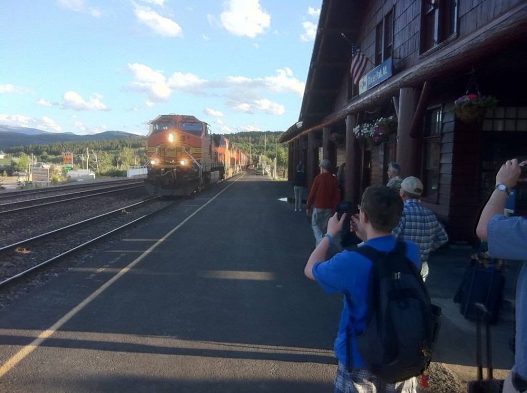 A BNSF freight passes the East Glacier National Park Amtrak station after crossing the continental divide through Marias Pass, MT on Aug. 7, 2011. Photo by Bill Corum