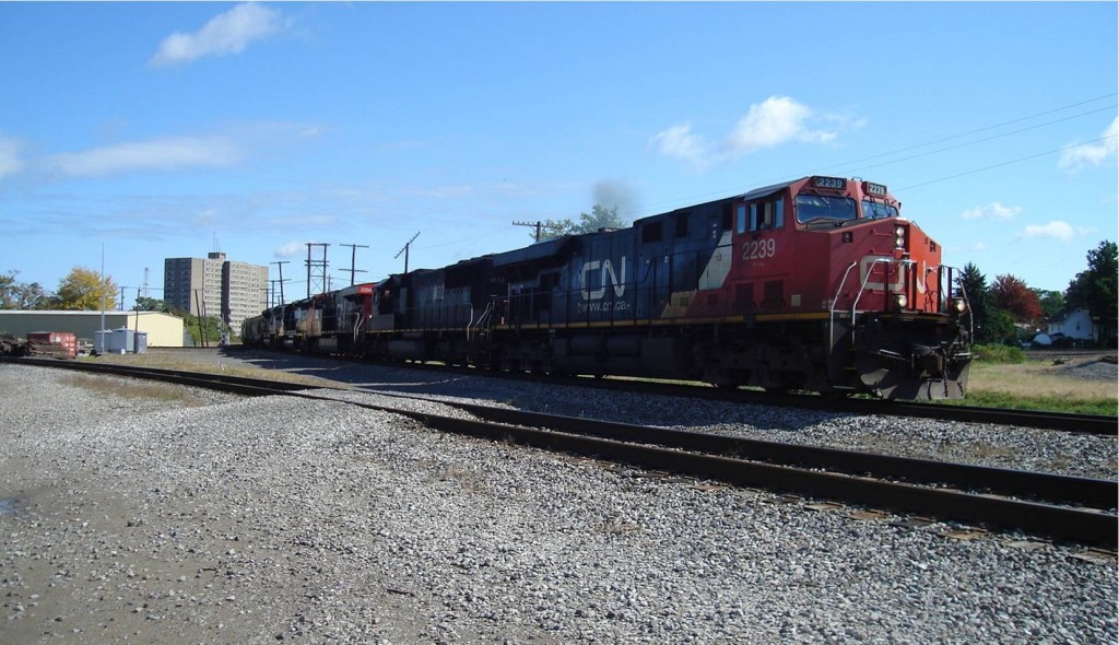 Southwest bound Norfolk Southern Train M-15 highballs through Astabula, Ohio at high noon on October 4, 2011.  This train operates Buffalo, New York to Conway, Pennsylvania.  Ashtabula is the point where this train does a couple of reverse moves to continue it's way back to Pennsylvania.  Second unit is a former IC SD70, still in black paint.  Submitted by Chris Dees.