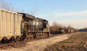 NS ES44AC #8047 is serving as DPU for an empty coal drag headed out of the Yankeetown Docks in Newburgh, IN on April 5, 2014 while a second NS train waits fro her crew to do the same -Matt Gentry