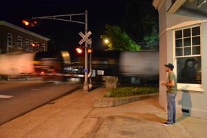 As a northbound train rolls north through Hopkinsville, Thomas Bryan observes outside the former L&N Depot. -Jennifer Brown; Kentucky New Era